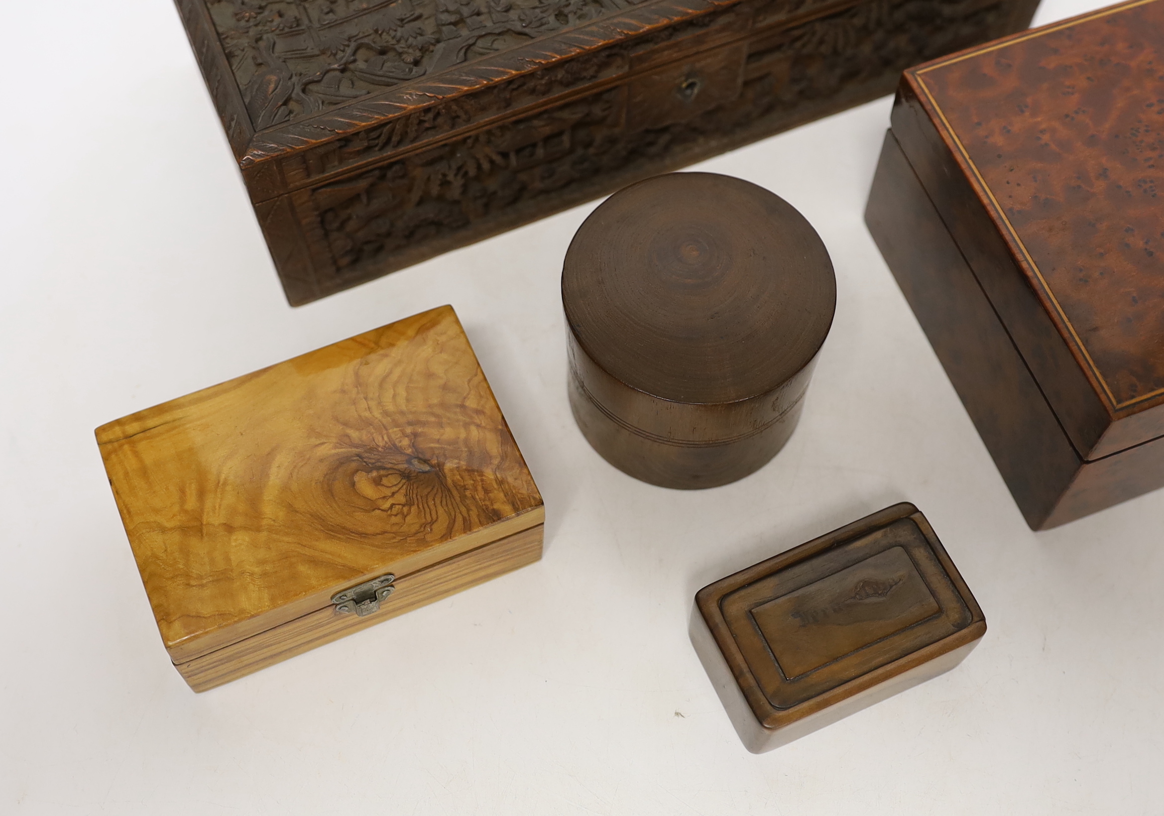 A 19th century Chinese carved boxwood box, an amboyna cigarette box and three others